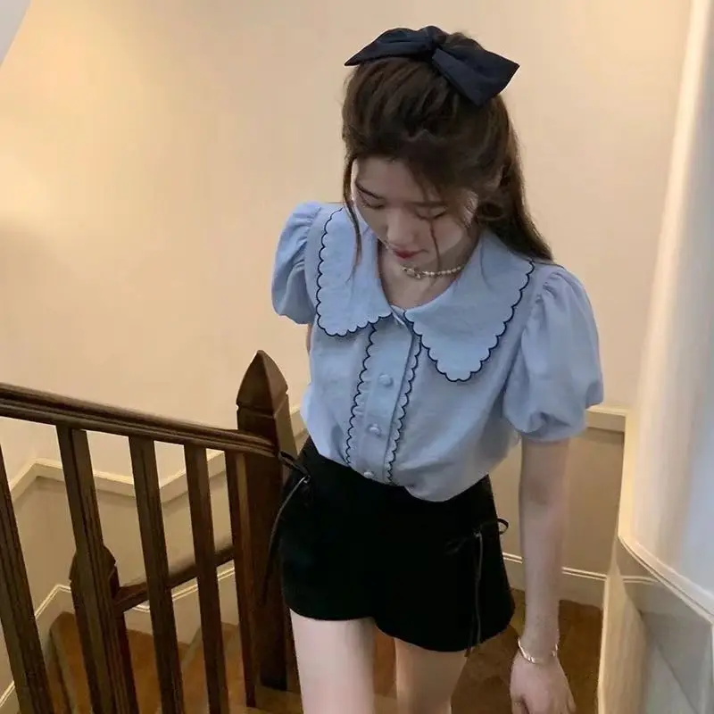 

French puff sleeve blue doll collar short-sleeved shirt female design niche 2025 new summer salt-line top