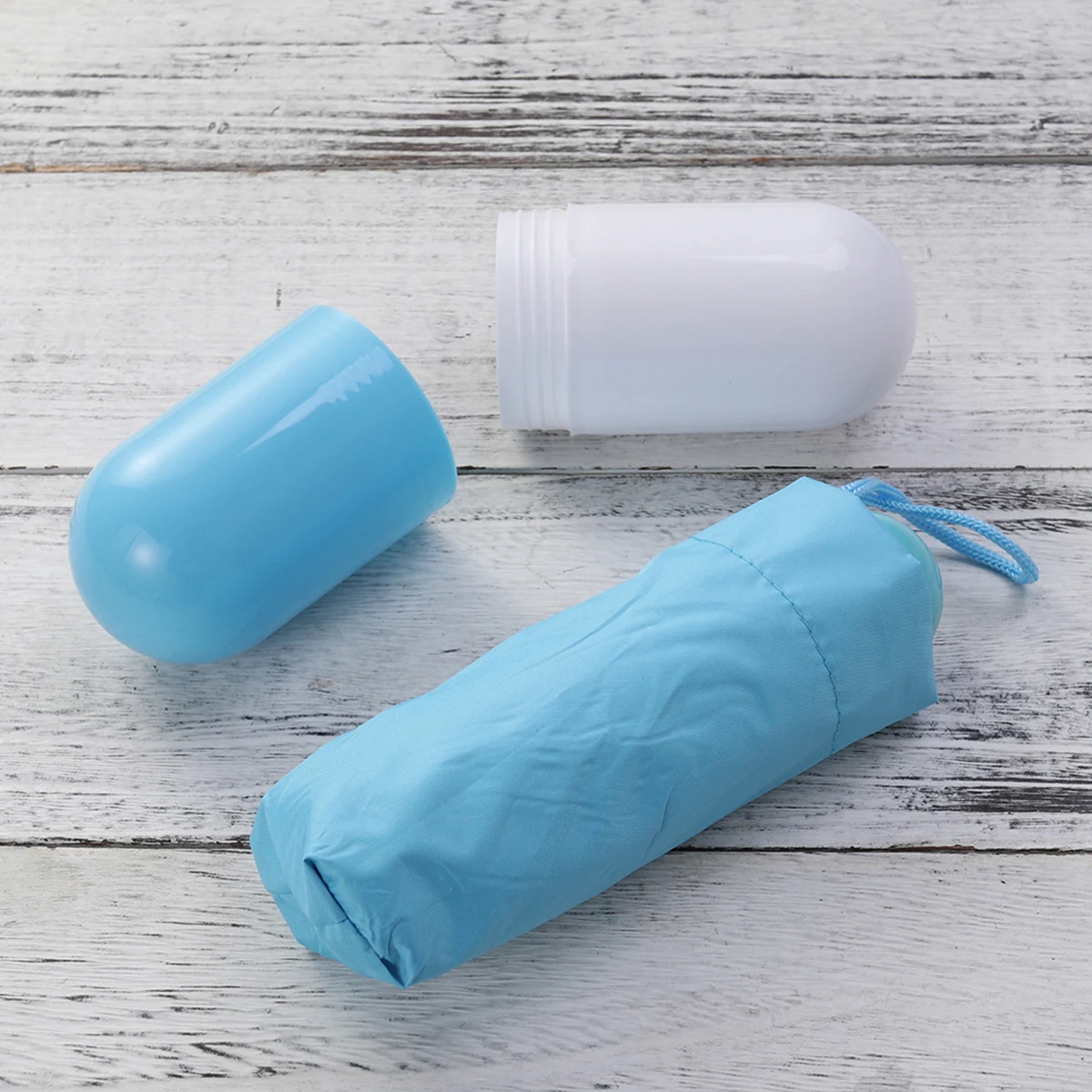

Mini Folding Compact Umbrella With Capsule Case Uv Protection 210T Fabric Lightweight Travel Essential Sky Blue Foldable