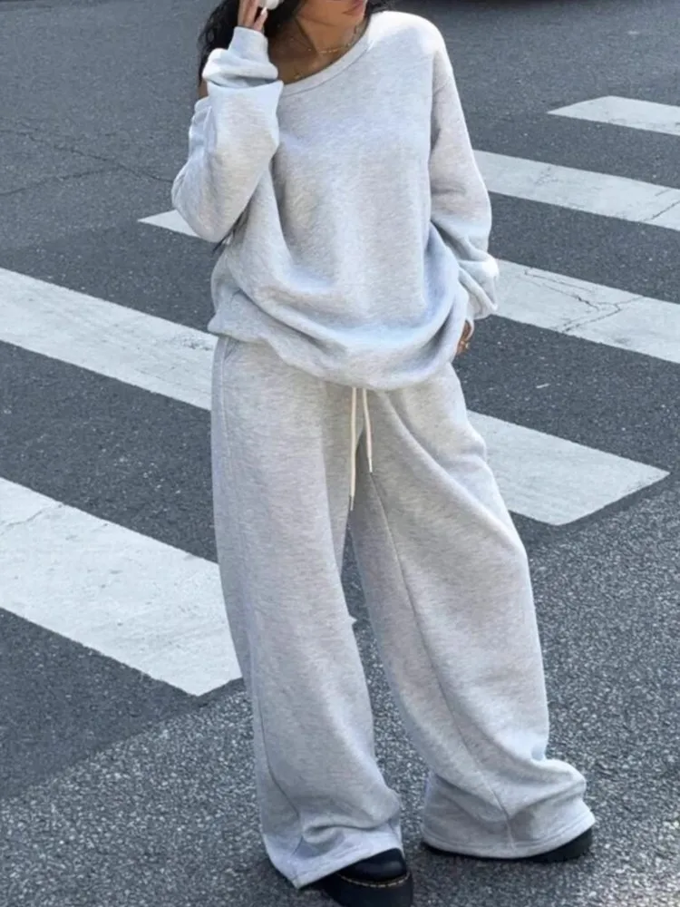 ชุดกางเกงสีพื้นสำหรับผู้หญิง ฤดูใบไม้ร่วงและฤดูหนาว สไตล์ลำลองแบบสปอร์ต เสื้อคอกลมทรงหลวม กางเกงขายาวทรงกว้าง ชุดสองชิ้น