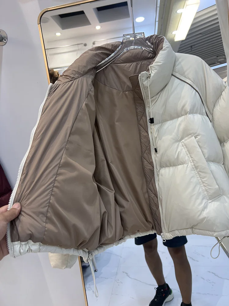 سترة شتوية جديدة بسيطة للنساء بنمط قصير النسخة الكورية بياقة واقفة ورباط غير متماثل معطف أسفل البط