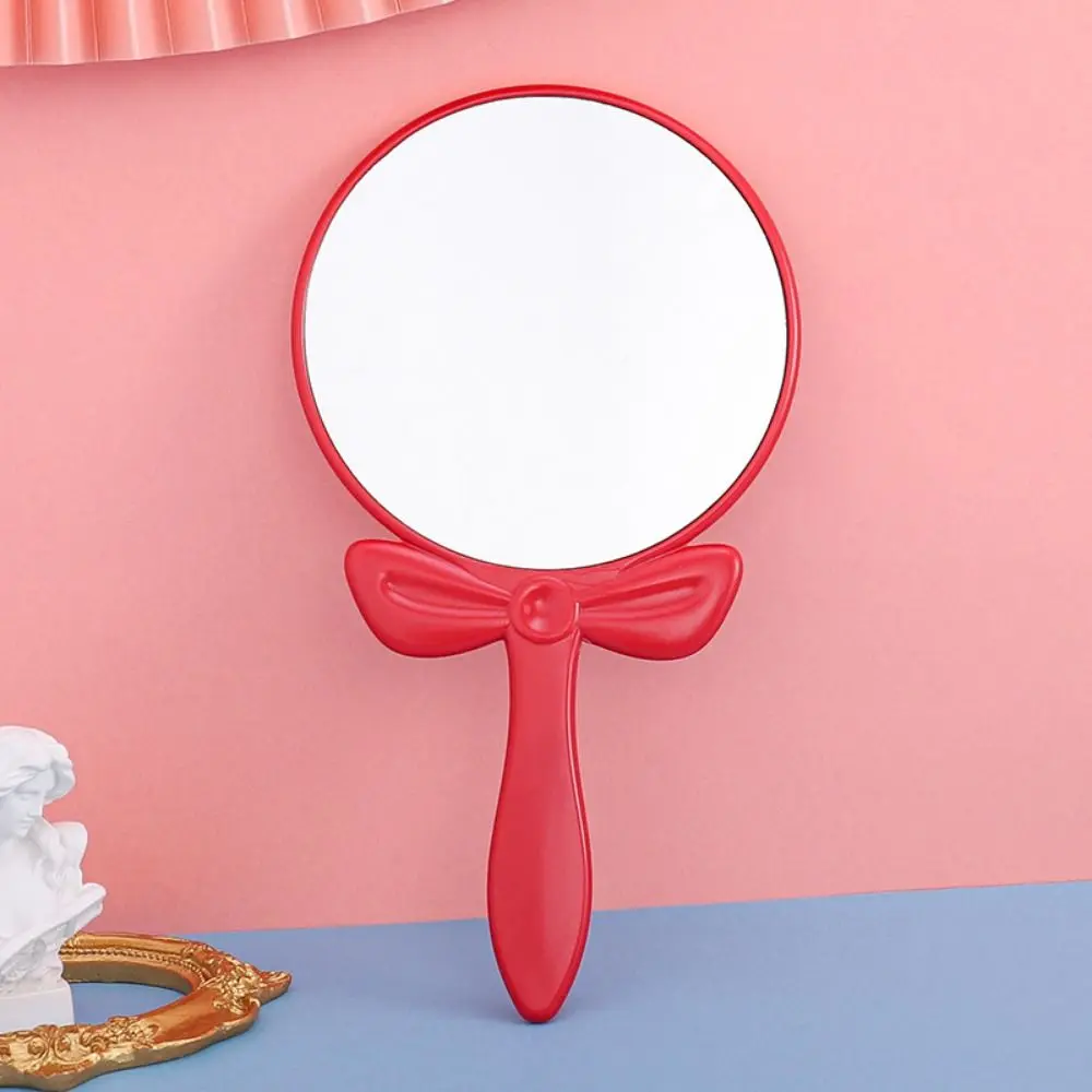 Simple Handheld Bow Make-up Mirror Beautiful Round Dressing Mirror High-definition Beauty Make-up Mirror Girls