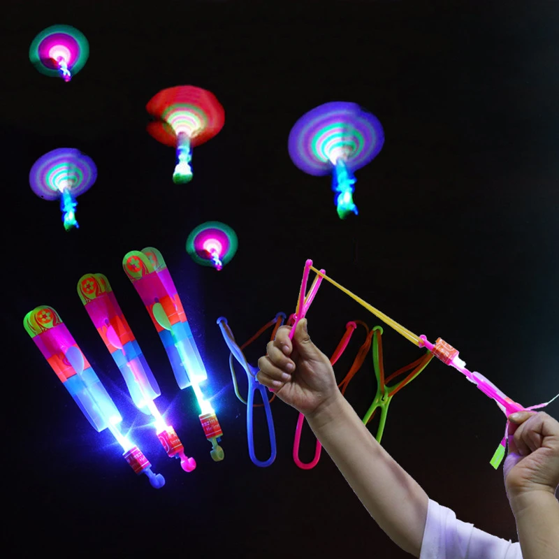 

1/2/5/10Pcs Funny Outdoor Slingshot Toys Shining Rocket LED Light Kids Mini Arrow Helicopter Shine Flying Elastic Rotating Toys