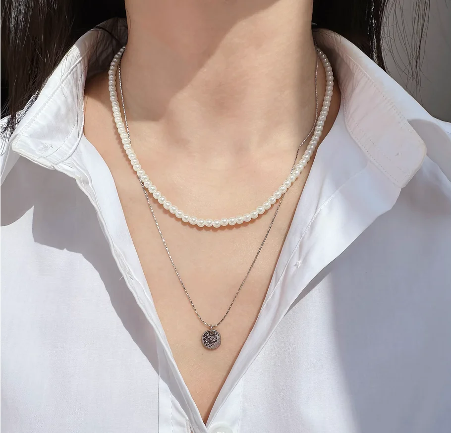 

Два комплекта костюмов внешней торговли, ювелирные изделия, элегантный темперамент, жемчужная цепочка на ключицу, вогнуто-выпуклая вафельная подвеска, тонкое ожерелье s