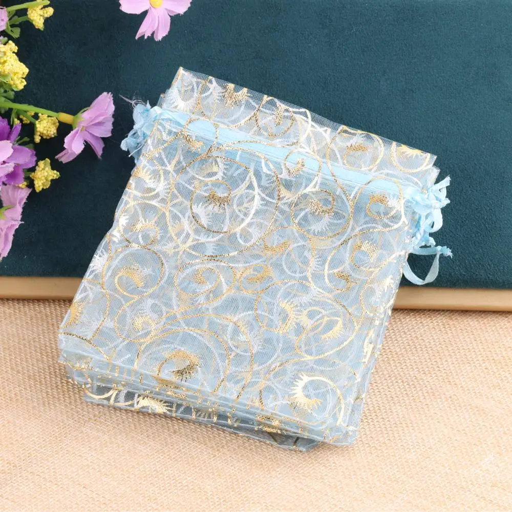 50 pz/lotto 9x12cm borsa con coulisse per gioielli regalo in Organza con stampa ciglia in oro