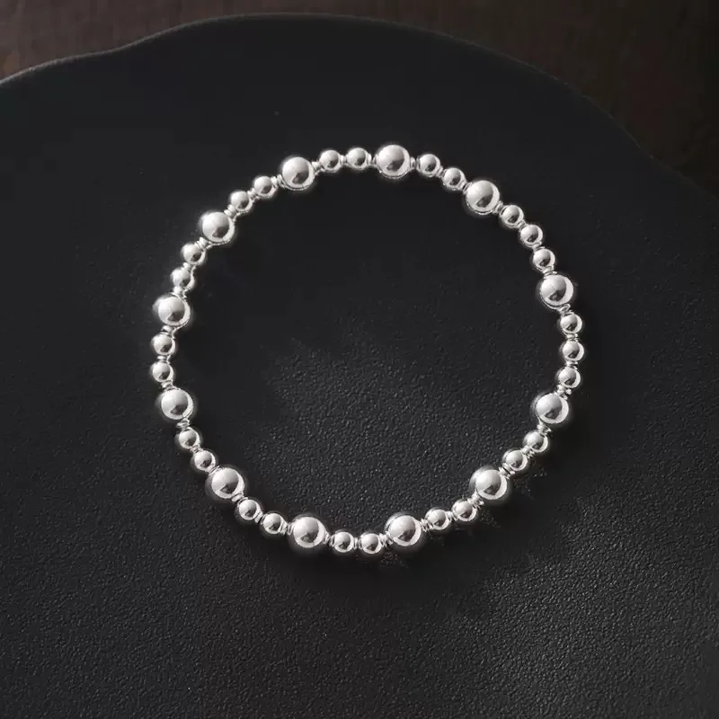 สร้อยข้อมือเงินแท้ 925 ประดับลูกปัดทรงกลม ของขวัญวันเกิด เครื่องประดับเงิน สร้อยข้อมือแบบยืดได้ รุ่นใหม่