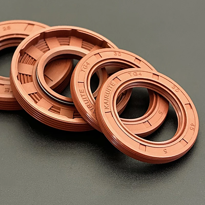 Seal ring berbahan fluororubber TG4, rangka/selempang oli, diameter dalam (ID) 25mm, diameter luar (OD) 32mm~62mm, bentuk bibir, seal berputar, tahan penuaan dan tahan ozon, berbahan FKM
