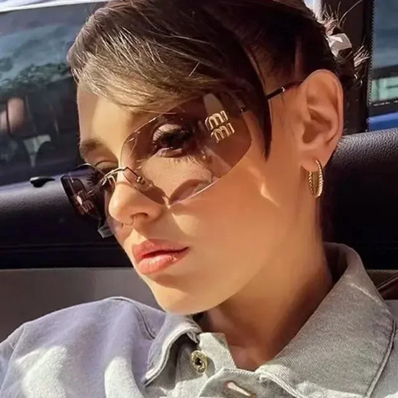 2025 Occhiali da sole da donna in metallo di lusso con design retrò senza cornice Occhiali da sole da escursionismo da viaggio con decorazione di alta qualità