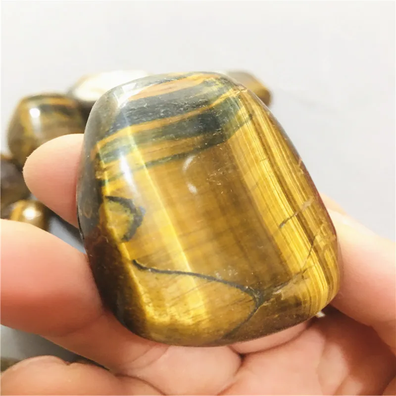 Natural crystal tiger's eye stone accompanies you, holding a rolling stone and massaging it
