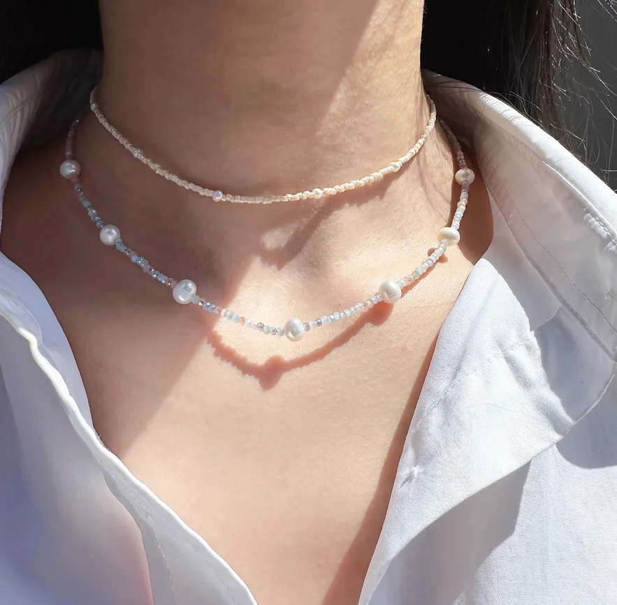 

Внешняя торговля ювелирные изделия ниша из натурального жемчуга и кристаллов из бисера ожерелье темперамент сложенная цепочка на ключицу Джокера.