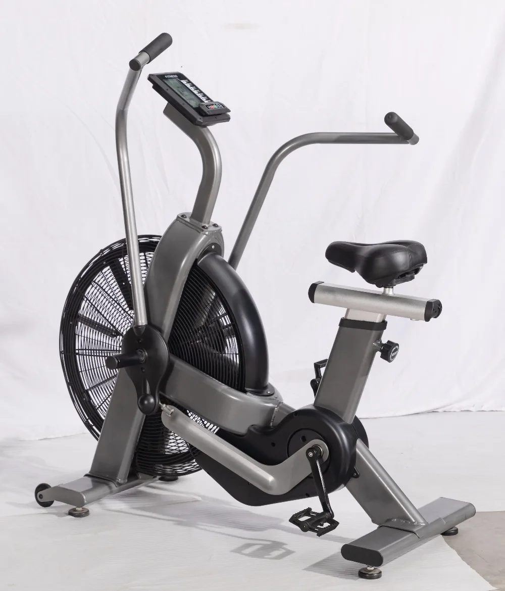 Vélo de rotation d'intérieur à volant d'inertie avec ventilateur en acier, système d'entraînement par courroie de frein magnétique pour l'exercice de combustion des graisses dans la salle de sport