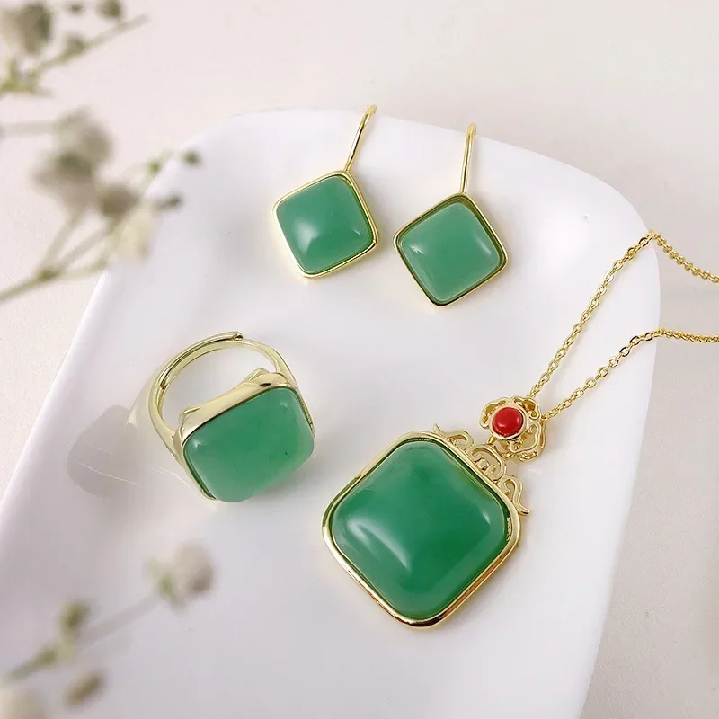 

Natural Xinjiang gold silk jade inlay three-piece set Dongling jade pendant pendant earrings ancient enamel jade