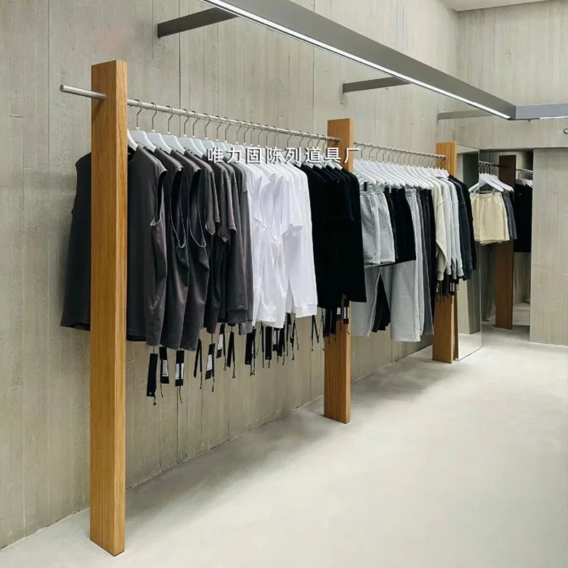 

Настенная стойка для магазина одежды Вешалки для магазина покупателя Вешалки для витрин для магазина мужской и женской одежды Настенные вешалки из цельного дерева Настенные