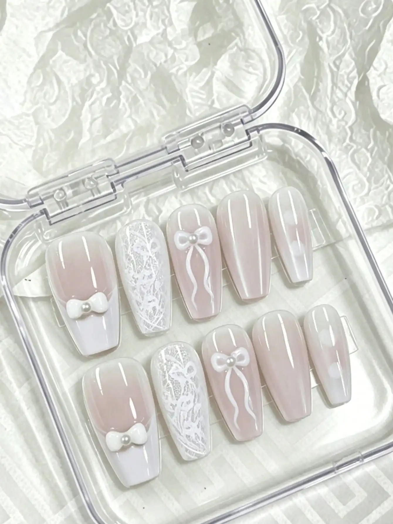 10 Pieces of Medium-Length Press-On Nails, with a Gentle Nude Pink and Milky White Gradient Base Color, Featuring Hand-Painted Lace Texture and Three-Dimensional Pearl Bow, in a Gentle and Elegant Style, Perfect for Young Girls, Date Nights, Parties, and Casual Wear, Comes with Jelly Glue and Nail File