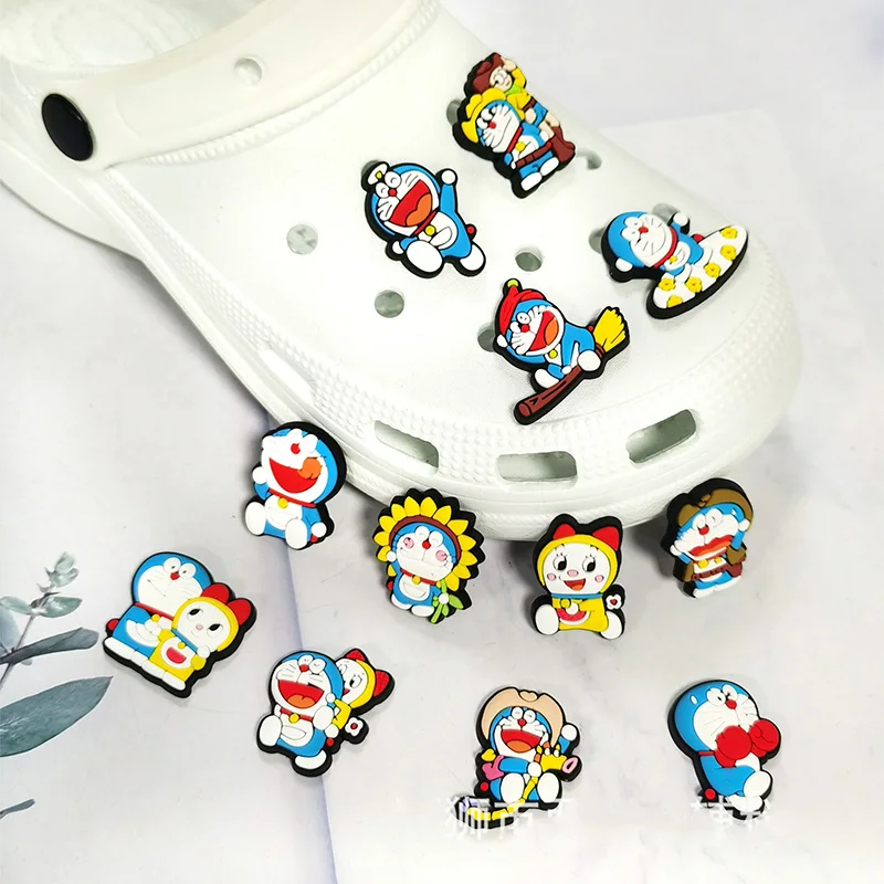 Juguetes calientes Dingdang gato Robot gato 12-100 Uds adornos para zapatos accesorios decoraciones PVC clásico hebilla de zueco para fiesta regalos de navidad aplicar