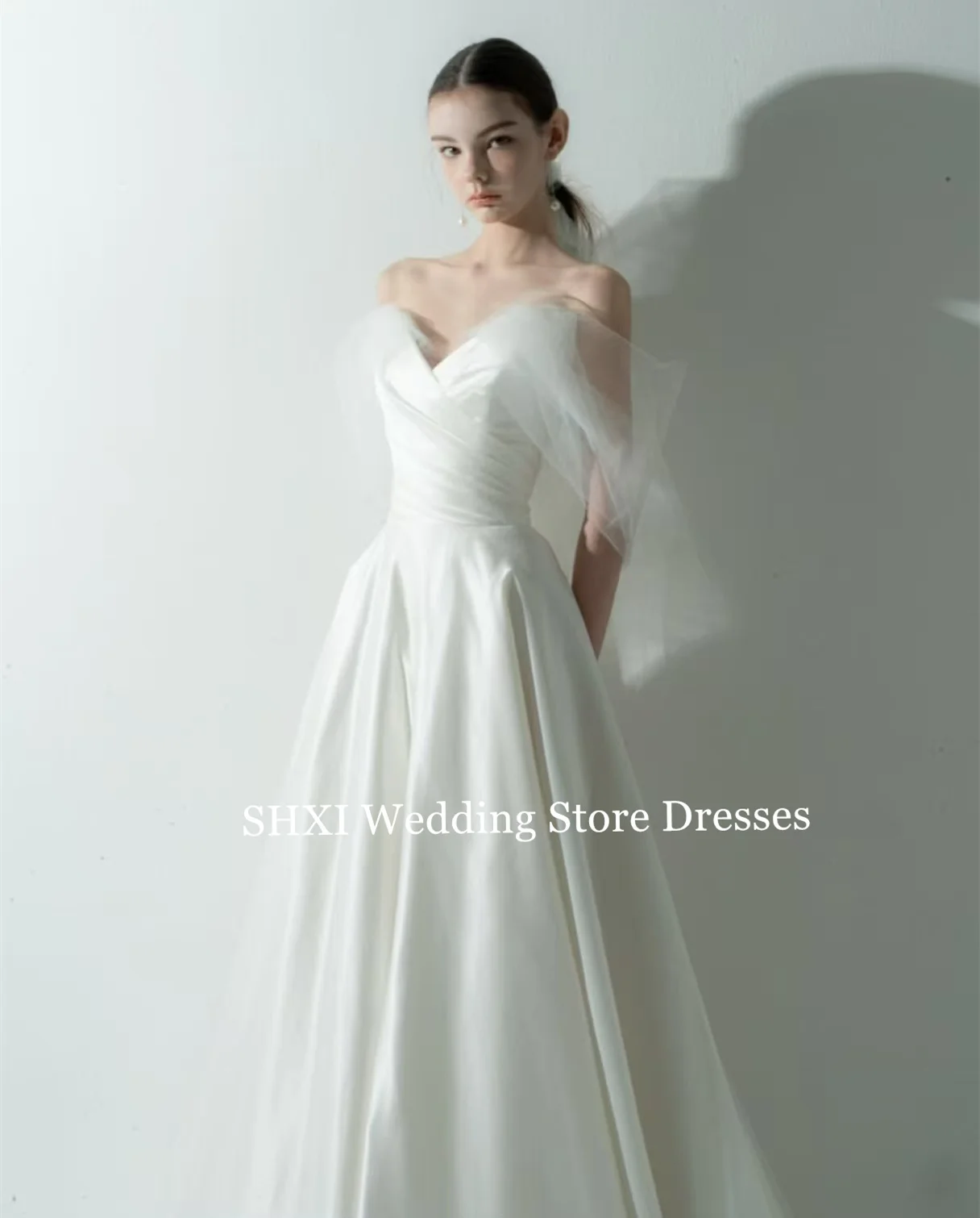 

SHXI White One Shoulder Wedding Dress Deep V Neck Satin Gown Sheer Sleeves Flowing Skirt Elegant Romantic Bride Gown Customize