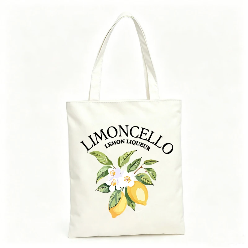 Women's canvas tote bag with lemon and floral graphic, ideal for casual outings and summer shopping