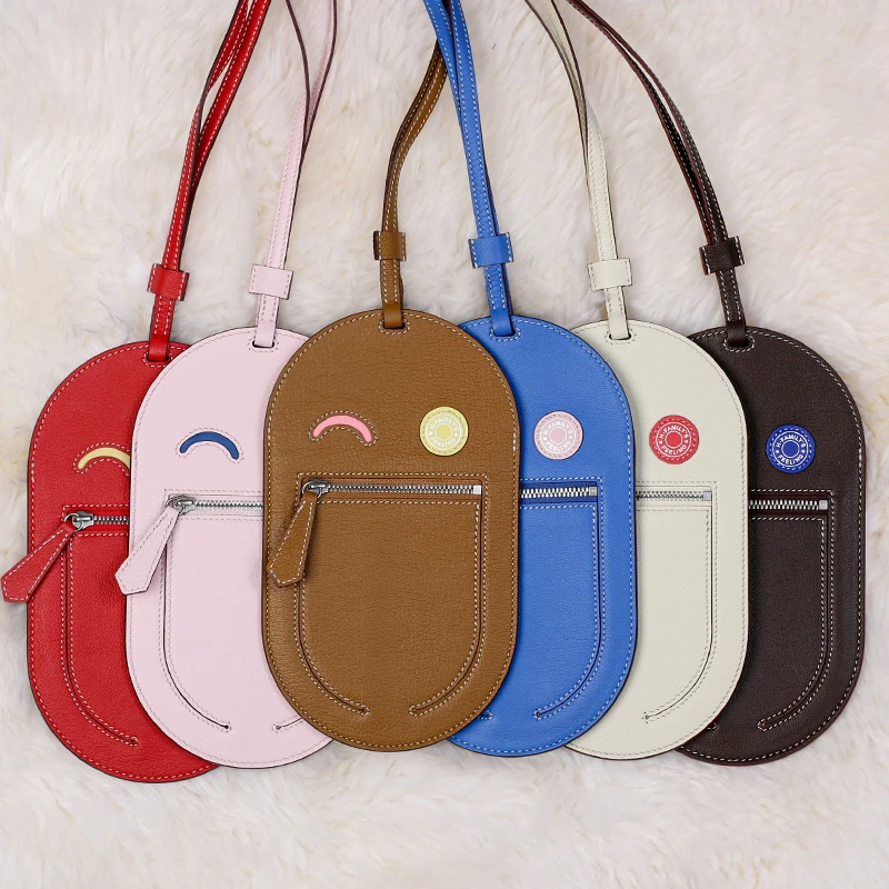 

2025 DIMYIn The Loop Phone To Go Smiling Face Phone Bag Hanging Neck Leather Phone Bag