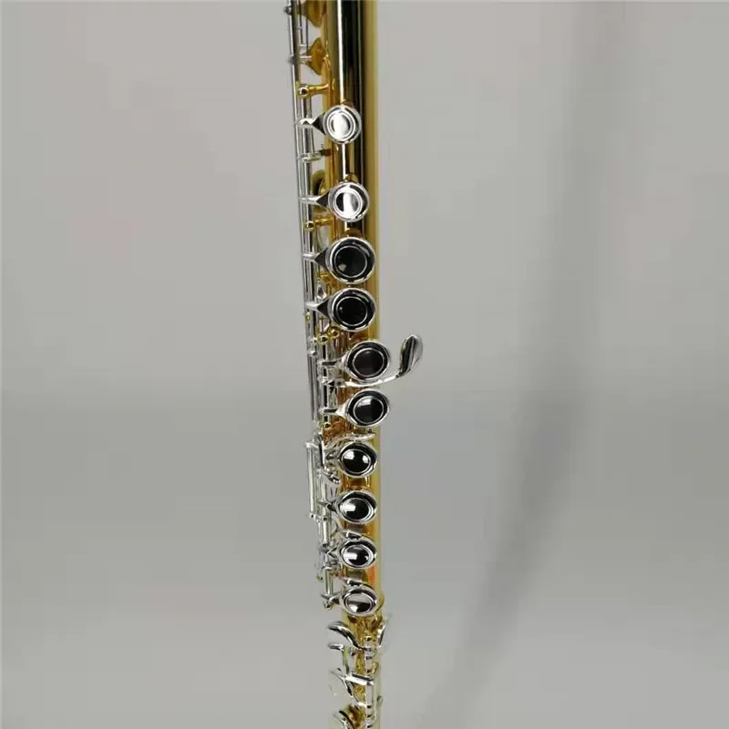 The flute has a gold-plated body, a 16-hole closed-hole opening and an E-key flute, and a colored flute for wind instruments