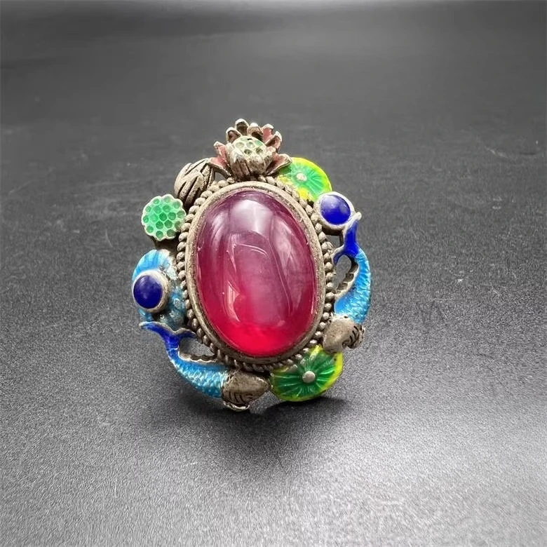 

enameled double-fish ring symbolizing continuous surplus, made of silver with inlaid starlight gemstone facets