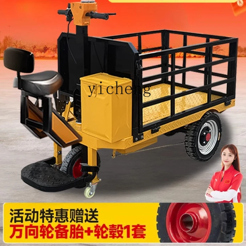 

XL electric flatbed truck, three-wheeled trolley for pulling bricks and goods at the construction site