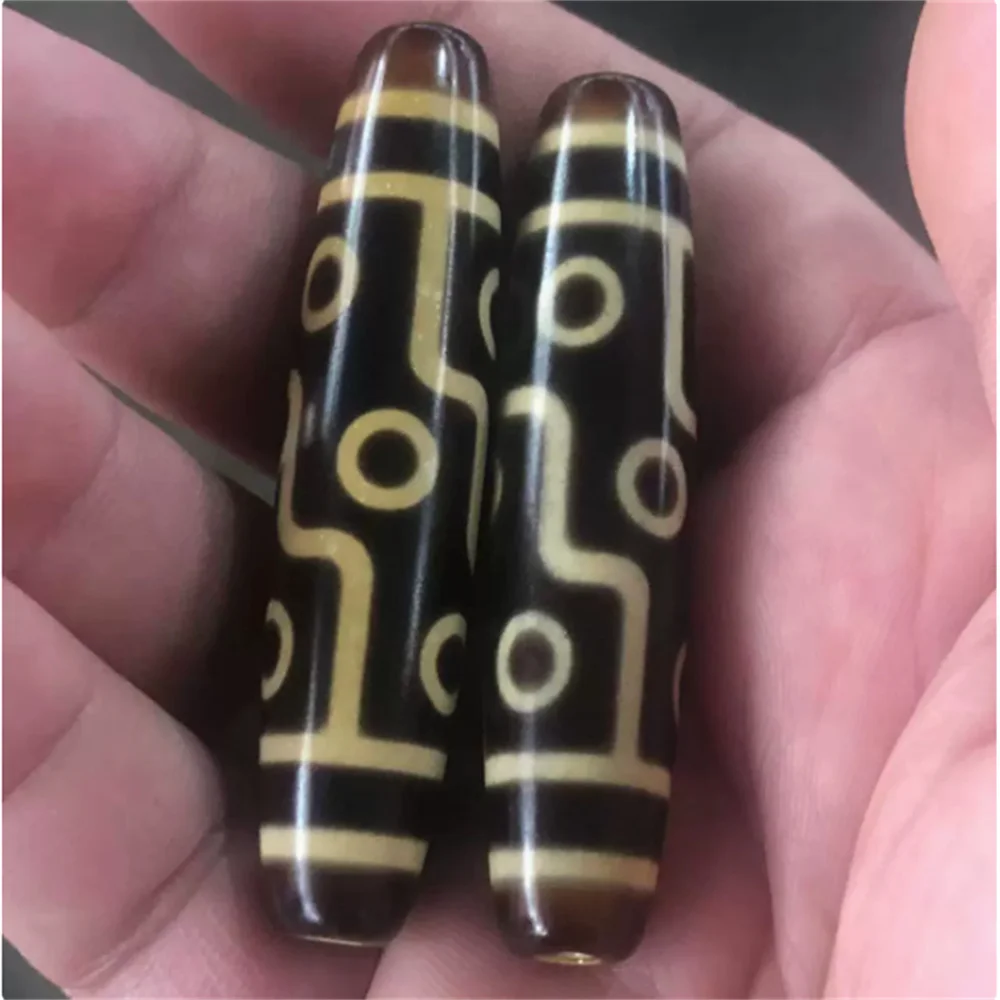 

Tibetan tooth-yellow nine-eyed agate Dzi bead platform work infiltration technique