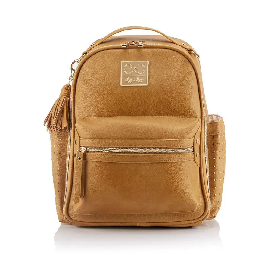 

Cole for Itzy Ritzy Mini Diaper Bag Backpack Studded Mini Backpack with Changing Pad, 8 Pockets, Rubber Feet amp Tassel Caramel