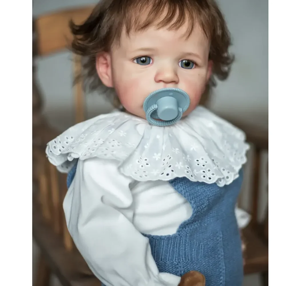 24inch With Hand Root Hair Wearing White Top And Blue Knitted Strap Pants Multiple Layers Painting Lifelike Reborn Sandie Doll