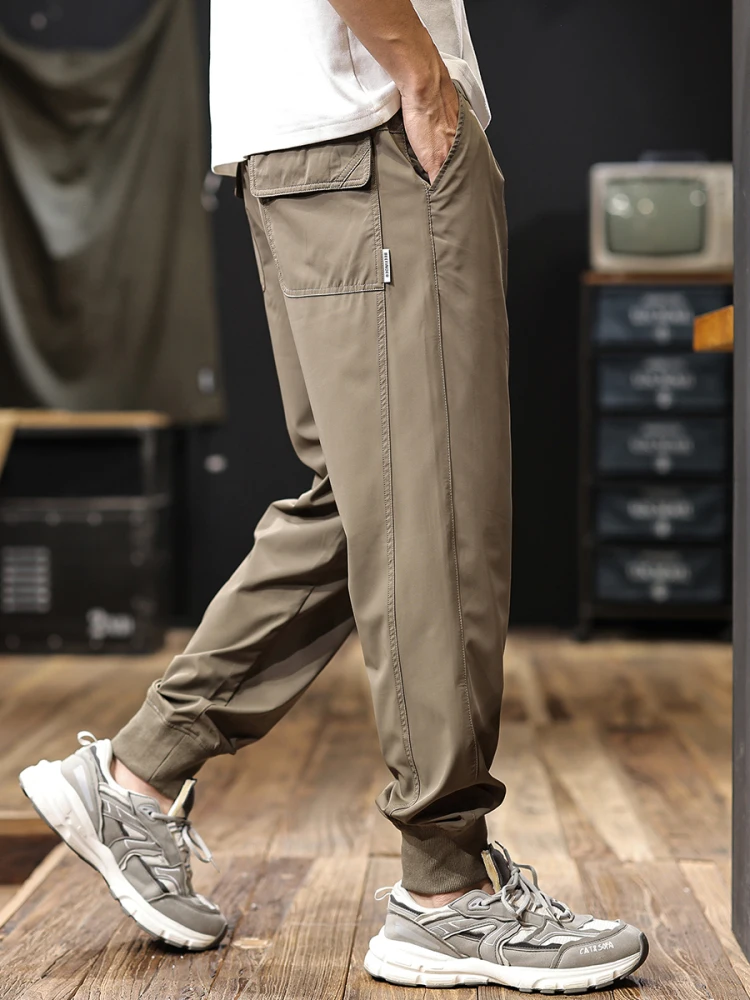 

Американские повседневные брюки из ледяного шелка в стиле ретро, мужские летние новые крутые дышащие длинные брюки с манжетами, рабочая одежда, свободная посадка, молодежные...