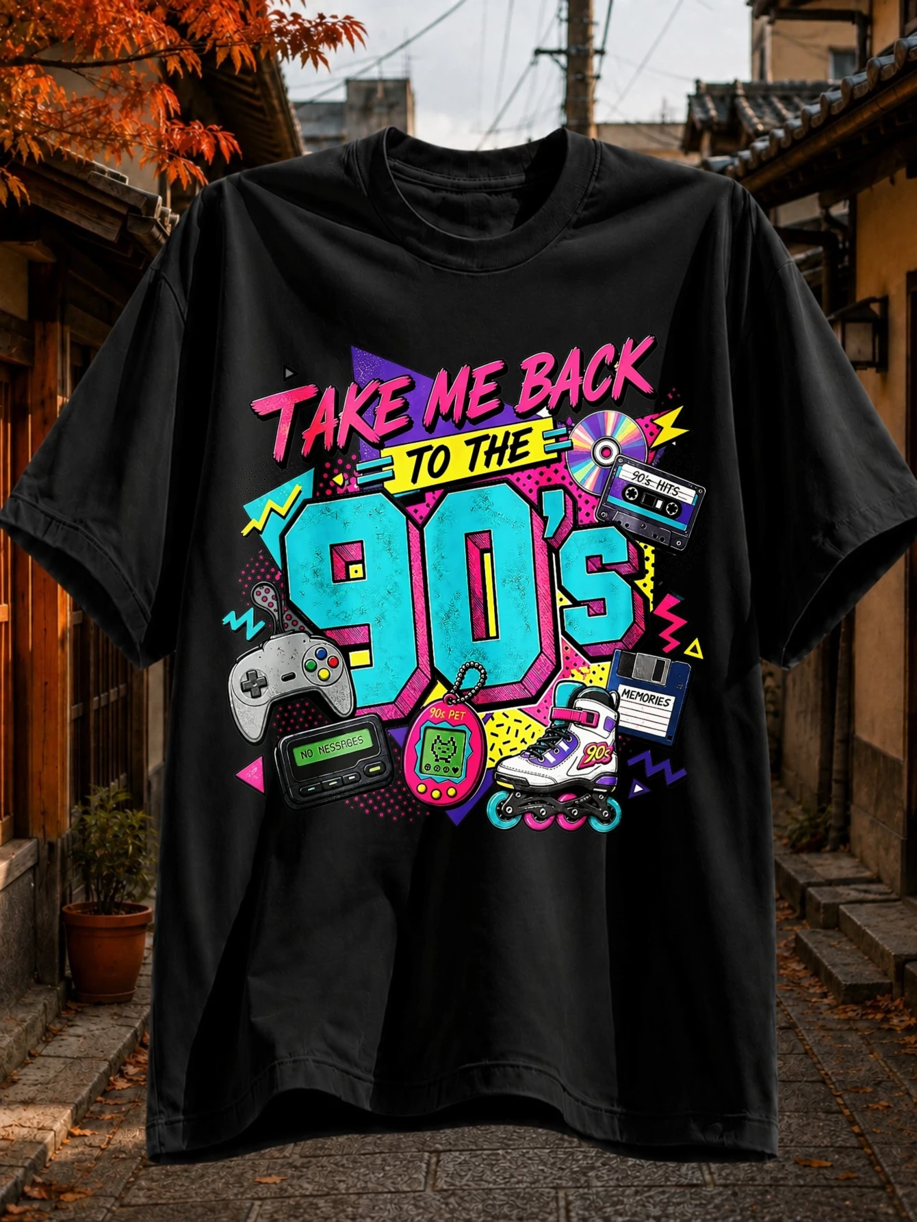 T-shirt noir avec texte graffiti 'Renvoie-moi dans les années 90', icônes de manette de jeu, téléavertisseur, animal de compagnie virtuel, patins à roulettes, cassette et CD.