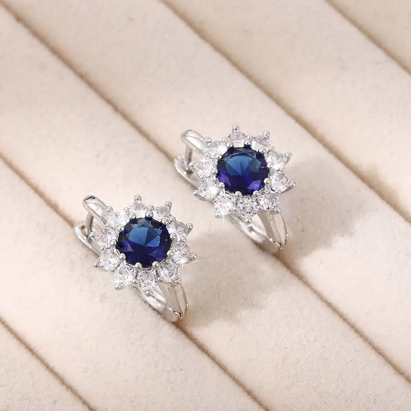 

Plated 925 sterling silver fashion inlaid sapphire temperament light luxury jewelry sun flower zircon earrings