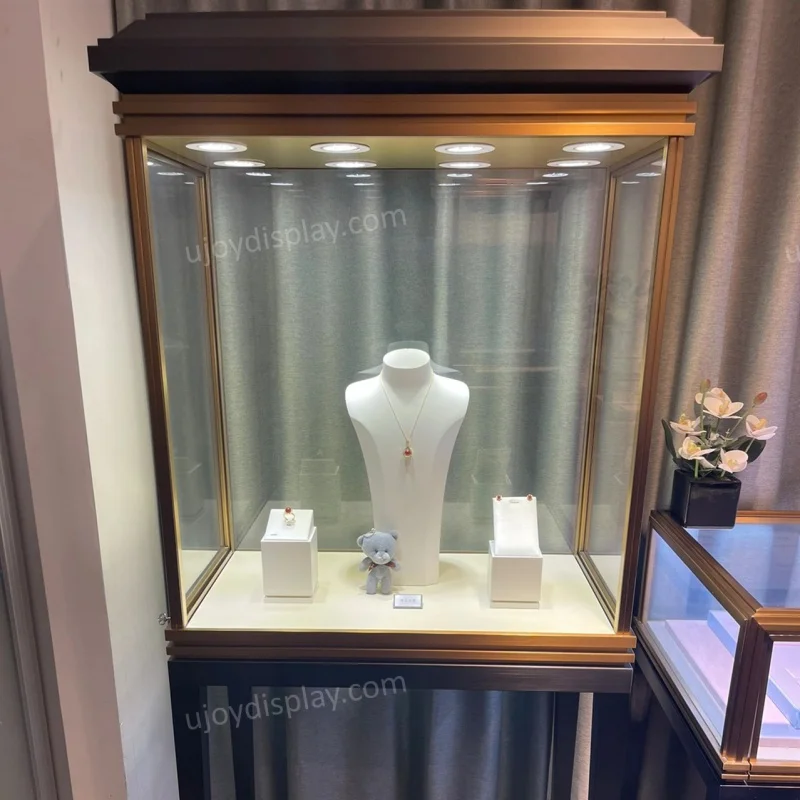 custom.Ujoy customized brass and black stainless color jewelry vitrine display showcase standing