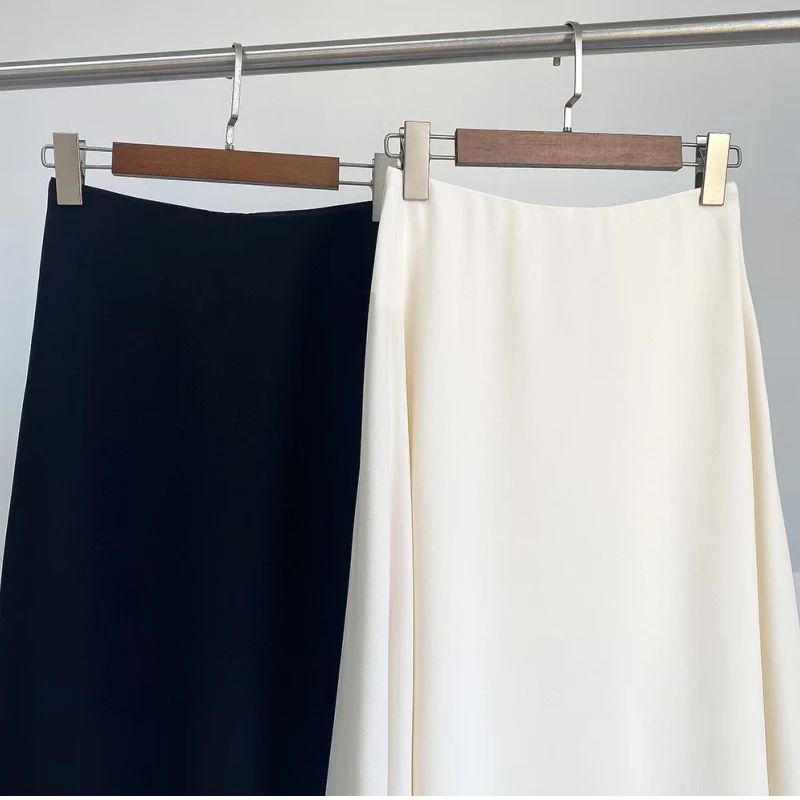 تنورة متوسطة الطول كلاسيكية على الطراز الأوروبي والأمريكي بعمر 25 عامًا بلون سادة معلقة بخصر عالٍ