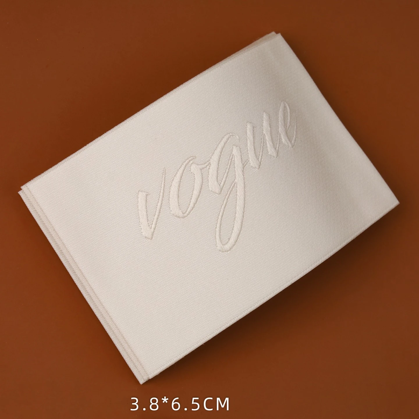 Custom Woven Labels Polyester Yarn Neck Tags Same Color Logo Embroidered Raised Brand Tags for High End Clothing