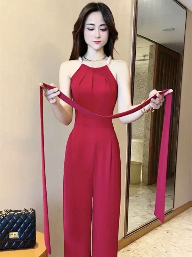 

Новый летний красный облегающий комбинезон для женщин, модный комбинезон с бретелями, без рукавов, однотонный, с завязками, высокой талией и широкими штанинами, элегантный комбинезон.