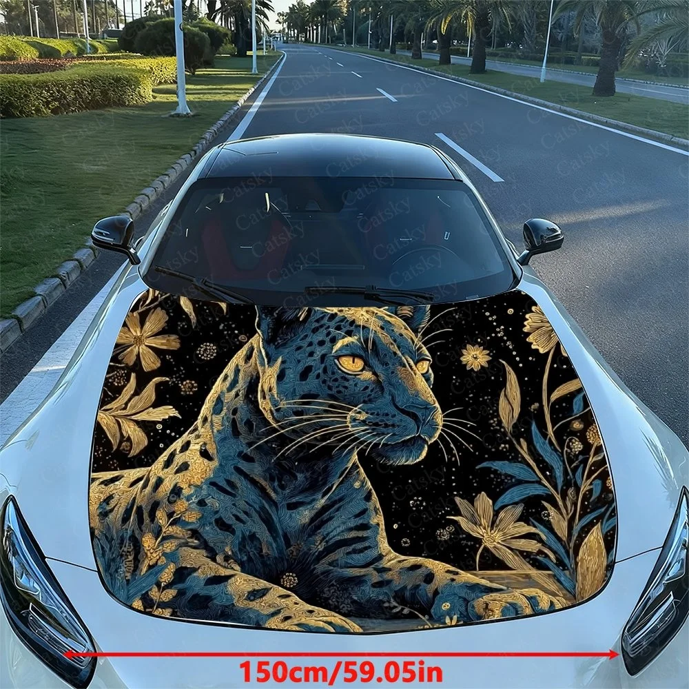 

Elegant car hood wrap featuring a majestic blue leopard with golden eyes, surrounded by floral designs on a black background.Car