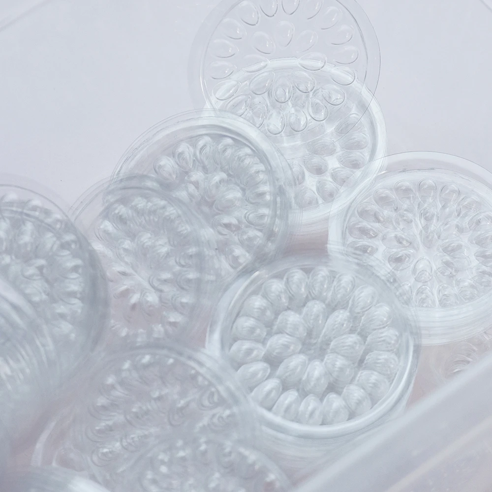 100 個使い捨てプラスチックフラワーまつげホルダーステッカー接着剤接着パレットまつげエクステンションメイクツール