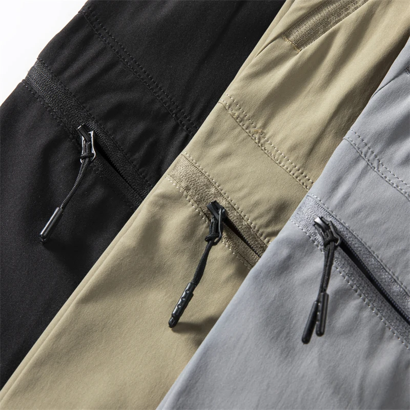 قسط عارضة الأزياء في الهواء الطلق للماء الرباط جيوب كثيرة مستقيم الرجال تنفس الرياضة السراويل الطويلة تخفيف السراويل