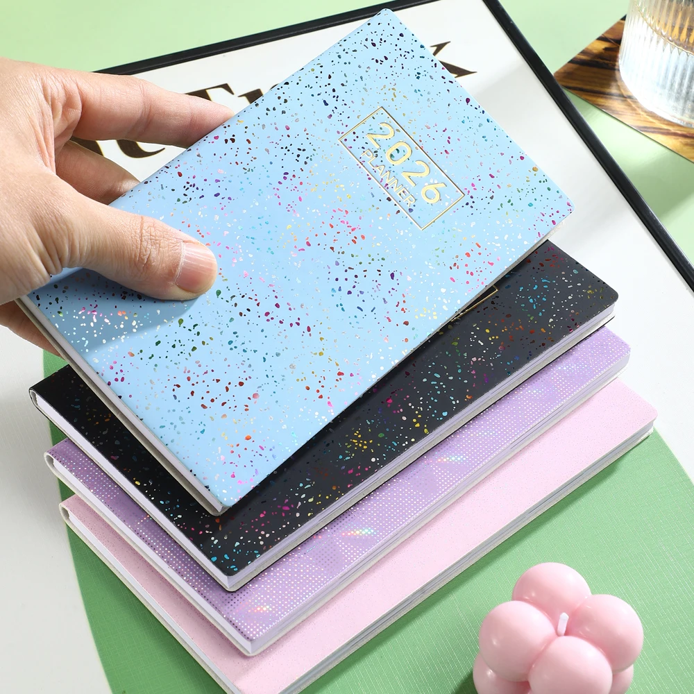 

1 шт. Еженедельный планировщик формата А6 на 2026 год, 64 тонких листа, 128 страниц, еженедельный календарь, расписной еженедельник с лазерной цветной обложкой.