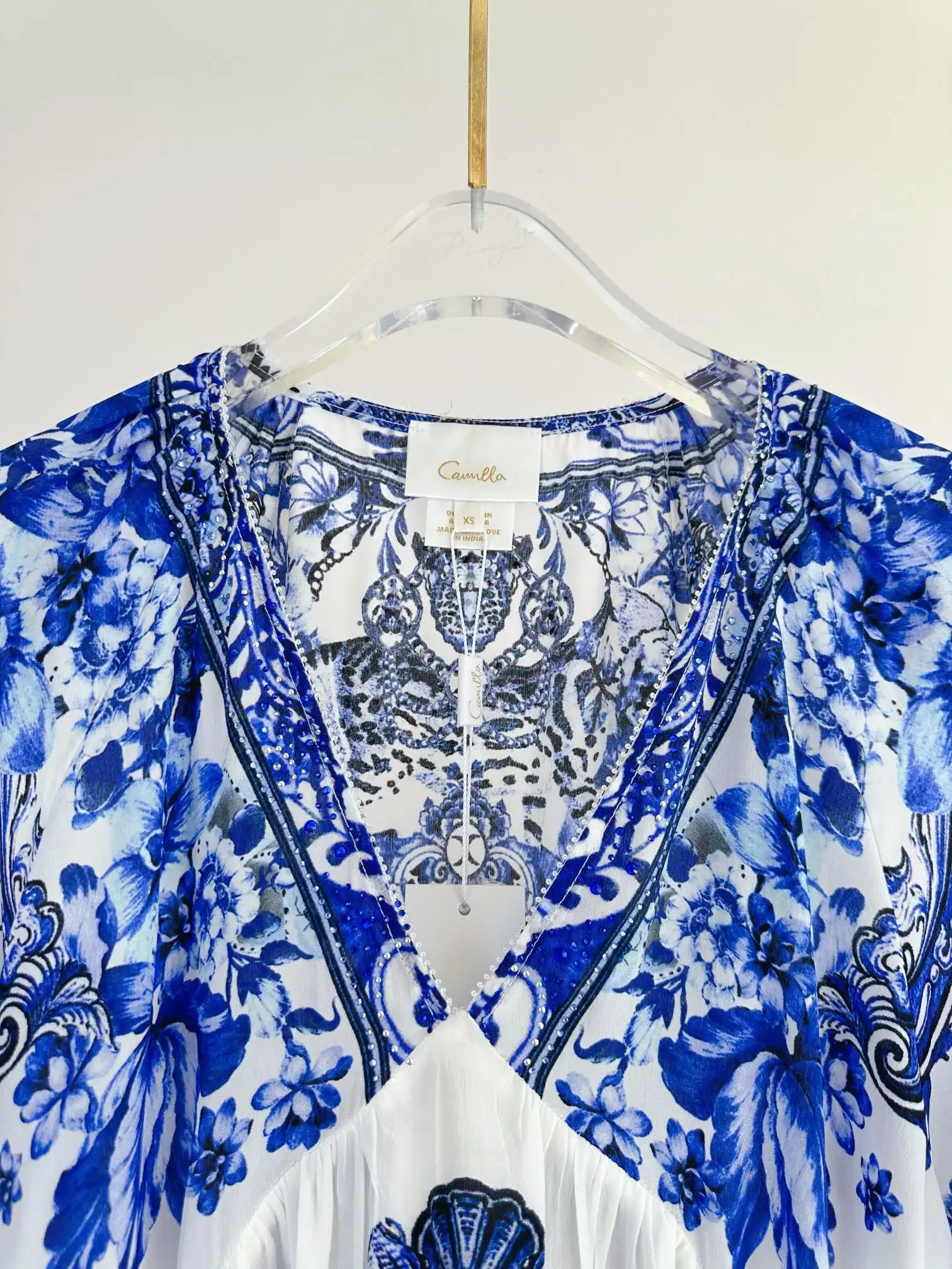 Blusa con estampado azul para mujer, camisa de seda holgada de manga larga con cuello en V, dobladillo Irregular, otoño 2024