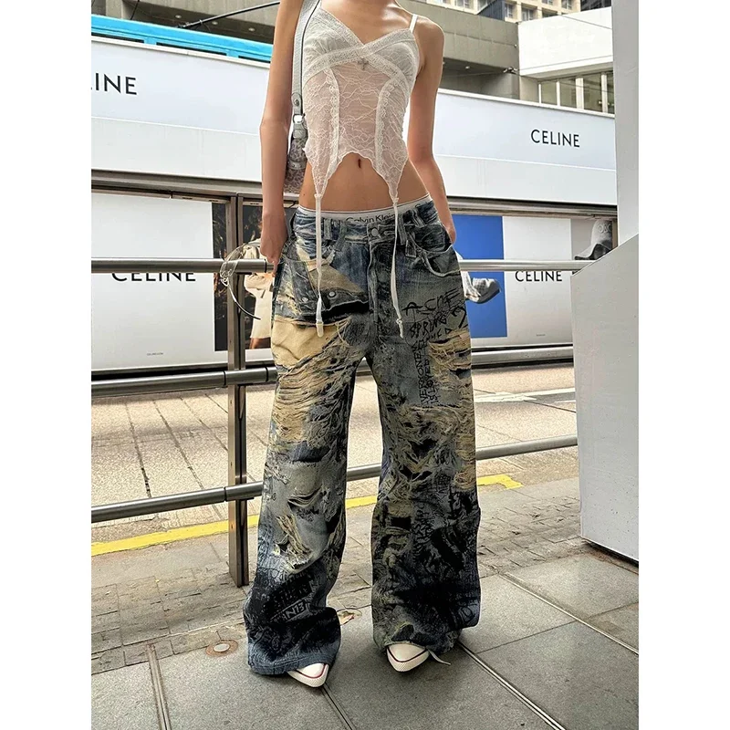 

Летние американские джинсы High Street с большими дырками, грязные окрашенные джинсы, женские Y2K, Харадзюку, панк, популярные брюки с принтом Spice Girl, расширенные брюки со шваброй