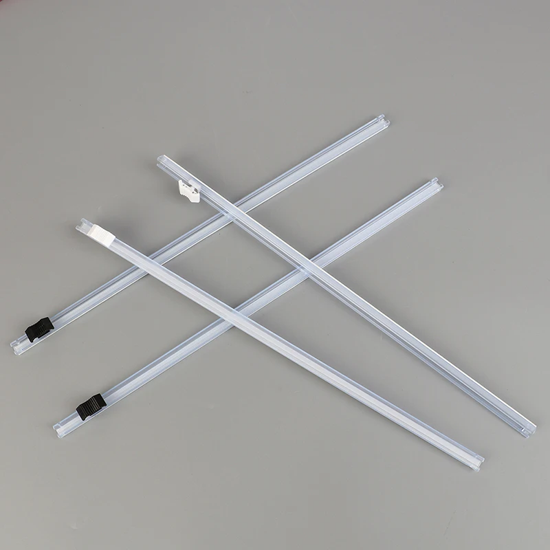 Dispenser per involucro di plastica e taglierina per pellicola per alimenti parte per taglierina per pellicola trasparente