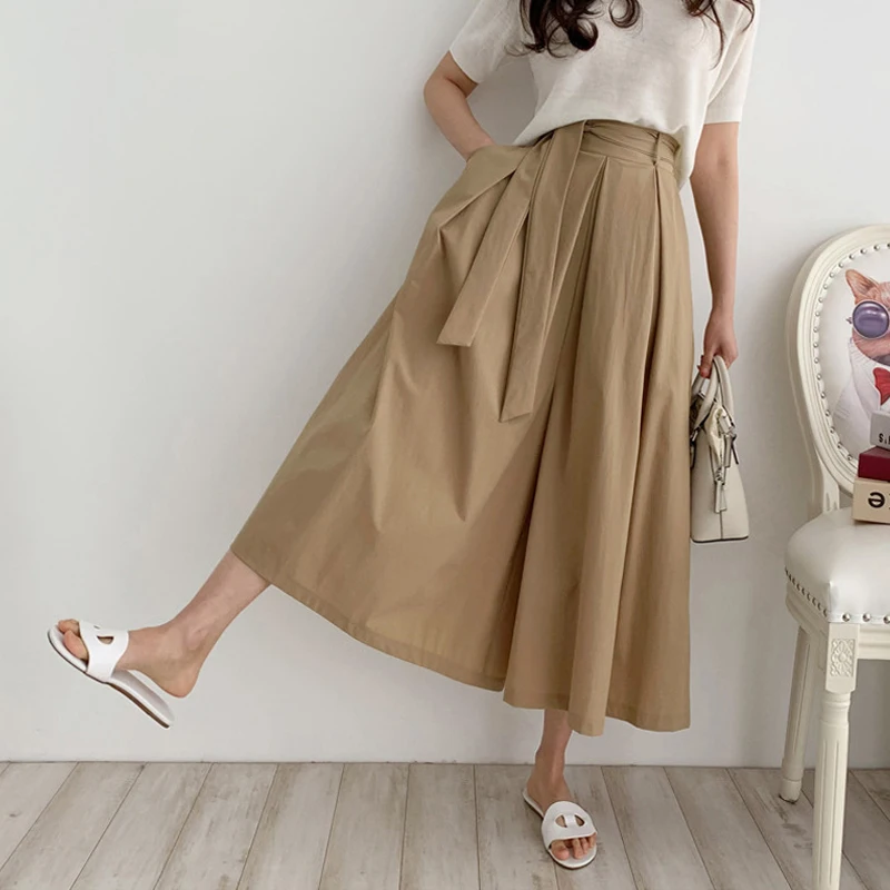 

Новая летняя плиссированная юбка средней длины с поясом и высокой талией в стиле ретро, юбки трапециевидной формы, корейские однотонные юбки для поездок на работу