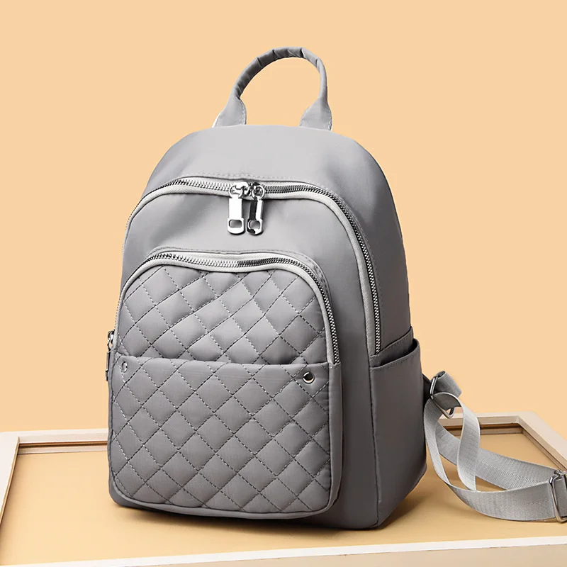 Bolso de hombro doble para mujer, mochila escolar Coreana de nailon de gran capacidad, mochila de viaje de ocio, ropa Lingge, novedad de 2022