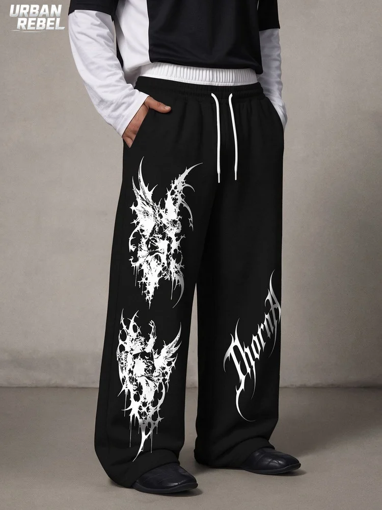 Pantalones de chándal negros para hombre, con doble cintura, corte holgado, estampado de letras con motivos de calavera alada y espinas, estilo gótico, corte amplio, estilo Y2K, ropa urbana oscura y alternativa.