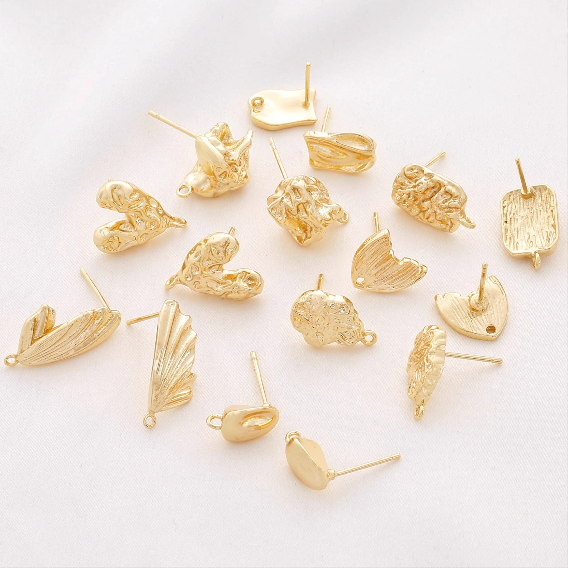 

1 pair of copper alloy plated with 14K gold to retain color, irregular heart-shaped lava wings with pendant earrings, diy