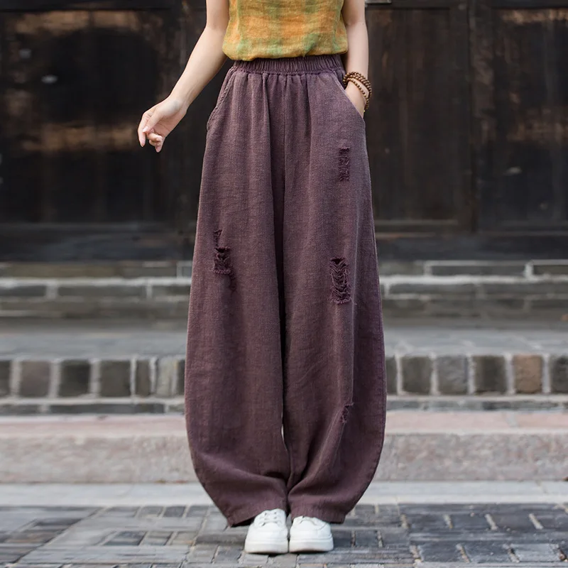 

Nomadic vibe harem pants. Featuring a ripped, stone-washed & tinted design for a unique autumn look.