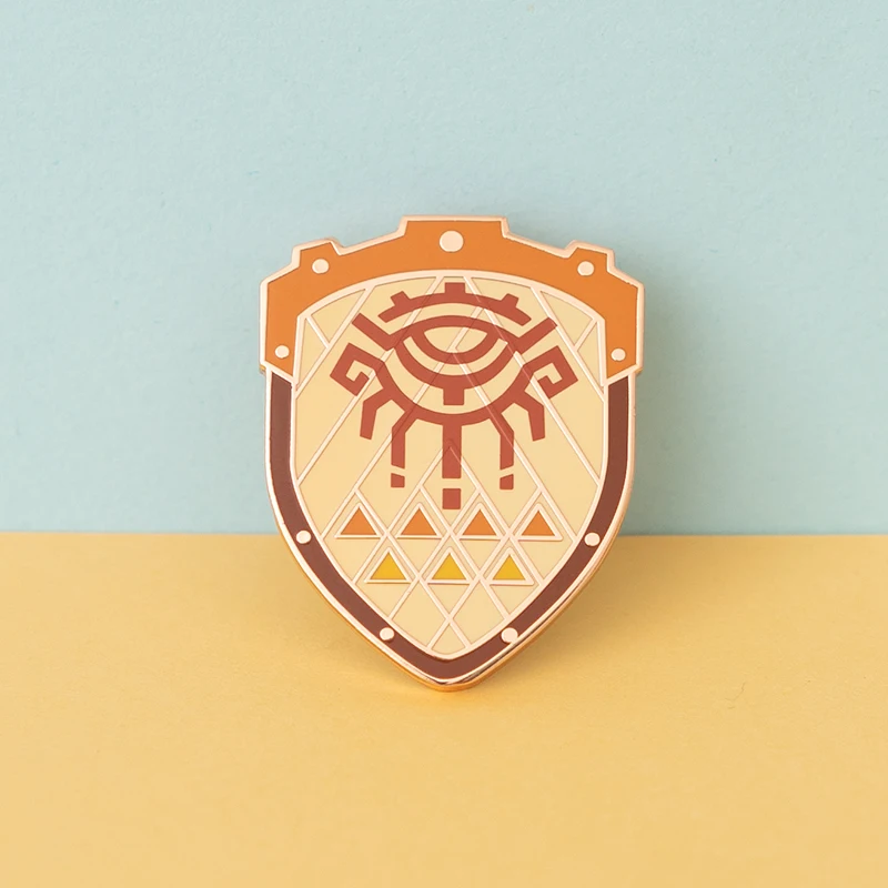 アニメバッジゼルダのハイリアの盾ピンブローチムジュラのマスクマスターソードバッジブローチラペルピンジーンズシャツバッグジュエリーギフト