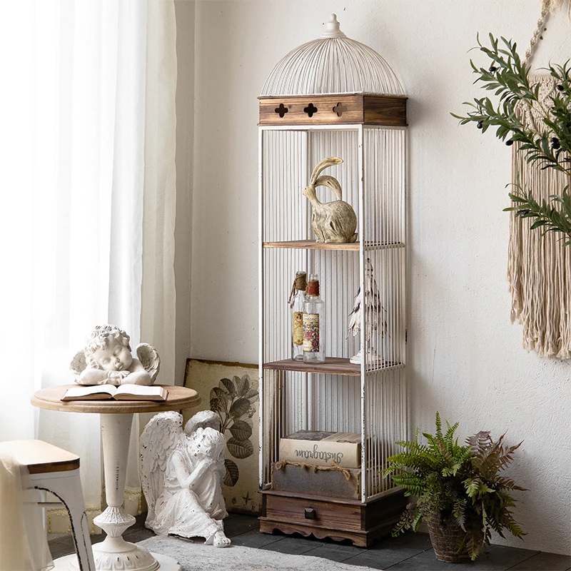 

American retro solid wood wrought iron bird cage, floor-to-ceiling multi-layer shelves next to the sofa in the living room, book