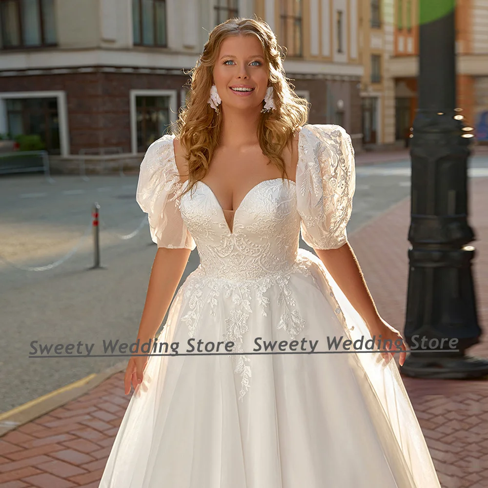 Vestido de novia de princesa, prenda de talla grande, escote Corazón, mangas cortas abullonadas, apliques de cola de barrido, corsé ajustable