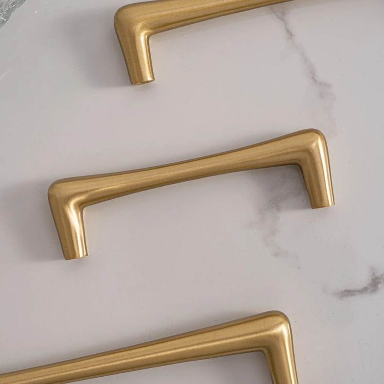 Brass handles showing their slim side profile